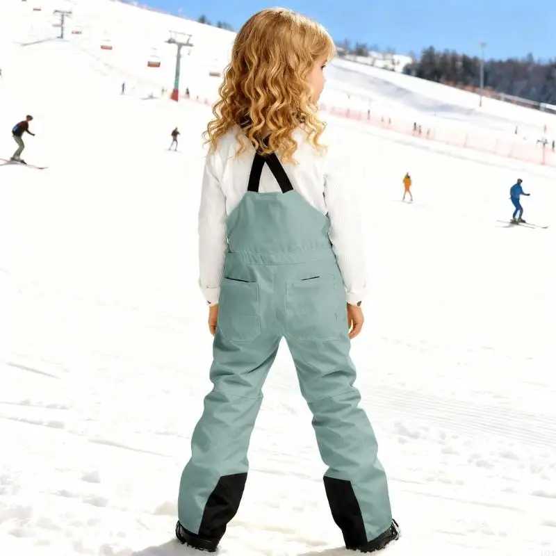 กางเกงสกีสำหรับเด็ก ผ้ากันเปื้ - Kids Outdoor Jumpsuit บทวิจารณ์และราคา